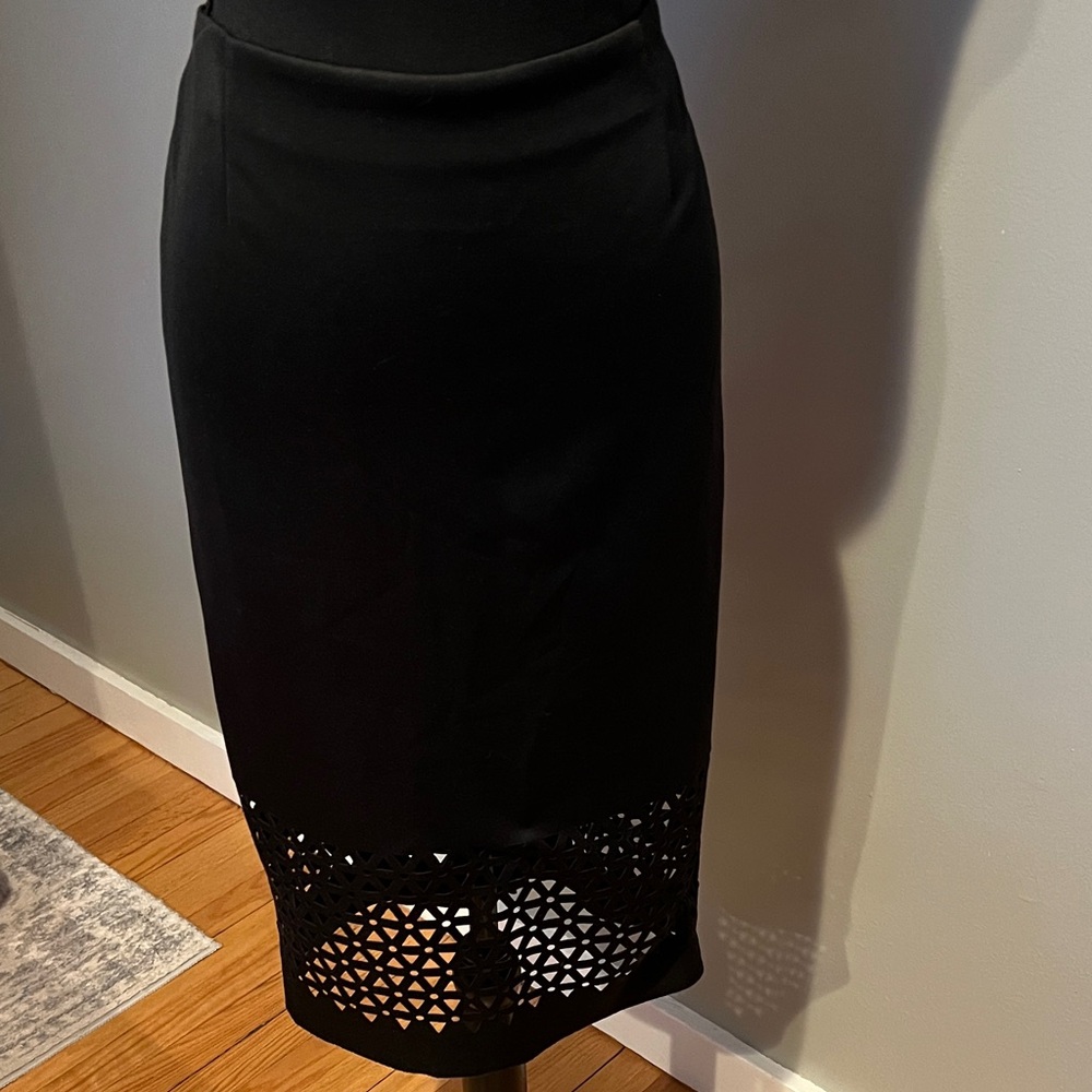 Elegant Black Midi Skirt with Cutout Hem